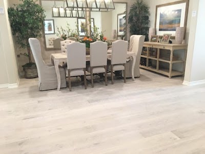 Elegant dining room with light oak wide-plank hardwood flooring, modern farmhouse styling