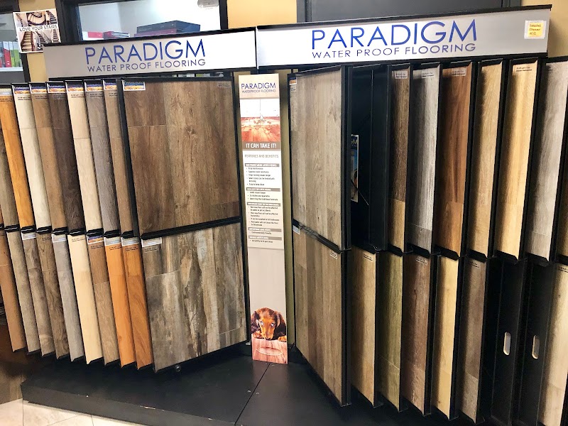 Specialist N Flooring showroom displaying Paradigm waterproof flooring samples in a variety of colors and textures